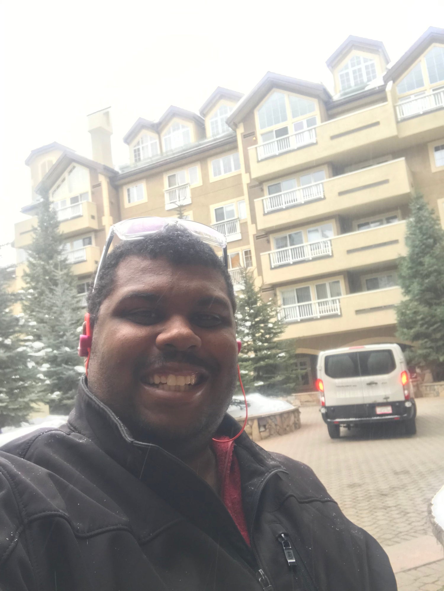 Powderhound driver and van smiling at ski resort in Colorado 888-248-7772